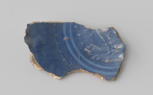 Fragment of majolica with a white figure on a blue ground