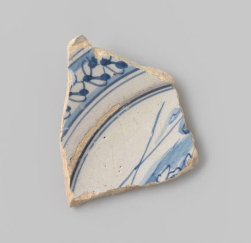 Sherd of white-fired earthenware with white glaze on the upper and lower sides, with remains of a bordered representation in blue visible on the upper side