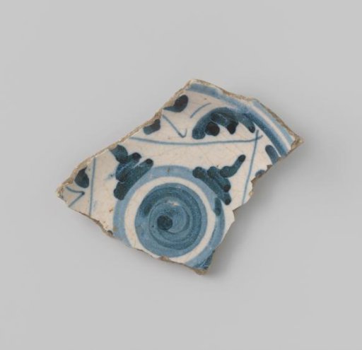 Sherd of white-fired earthenware with white glaze on the upper and lower sides, decorated on the upper side with a design in geometric forms in blue and on the lower side with stripes in blue