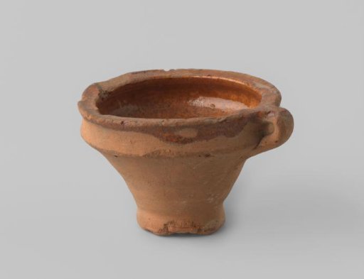 Round bowl with handle, of red-firing earthenware, damaged