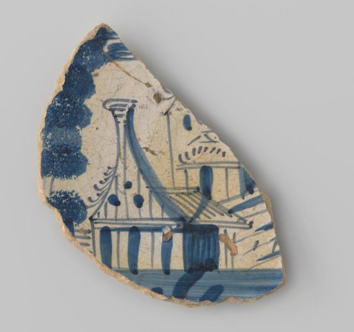 Fragment of a plate with a yellowish sherd, decorated with a painting of a building in blue on a white ground