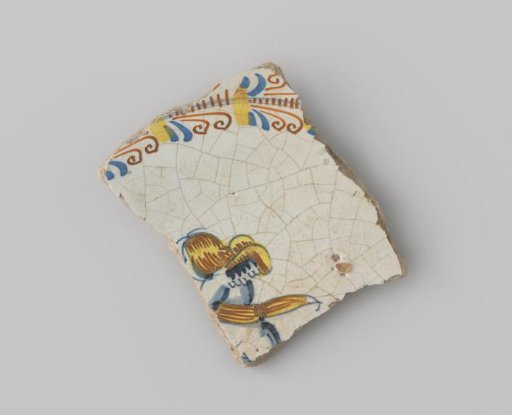 Fragment of white-firing earthenware, with a painting of a putto within a wreath of leaves in blue, yellow and orange on a white ground on the upper side