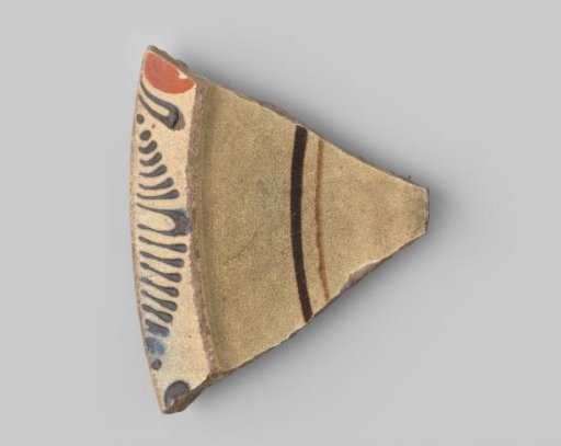 Fragment of white-firing earthenware, with a painting of stripes in blue, brown and orange on a yellowish ground on the upper side