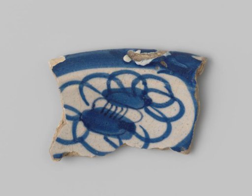 Fragment of white-firing earthenware, with a painting of flowers in blue on a white ground on the outside