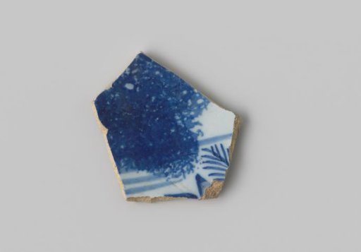 Fragment of white-firing earthenware, with a painting in blue on a white ground on the outside