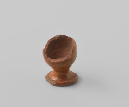 Sherd with foot, of red-firing earthenware, glazed colorless on the outside