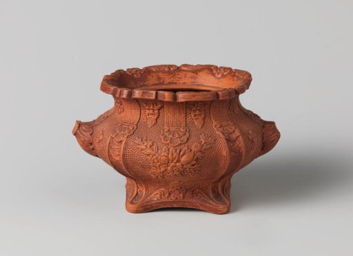 Sugar pot of red hard-baked earthenware.
