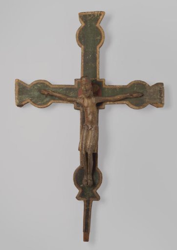 Crucifix with a figure of Christ with knees sagging to the left, feet placed side by side, and arms nearly horizontal