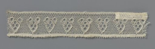 Strip of bobbin lace with hearts made of circles