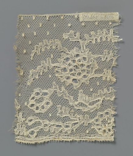 Strip of bobbin lace with irregular round flower