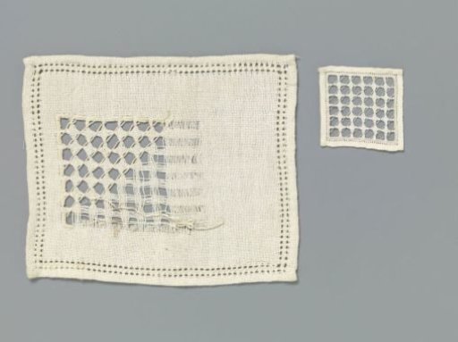 Steel linen with lace embroidery with drawn threads and four-pointed stars in a diagonal grid