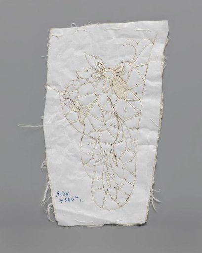 Prickings pinned on a double piece of cotton with tracing threads and needle lace stitches for making a part of a collar of needle lace