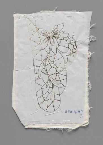 Prickings pinned on a double piece of cotton with tracing threads for making a part of a collar of needle lace