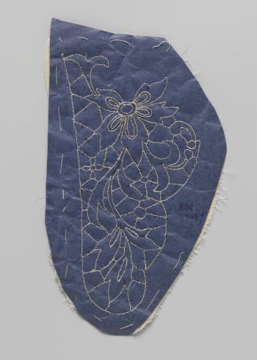 Prickings pinned to a double piece of cotton with tracing threads for making part of a needle lace collar