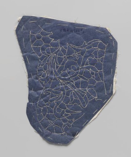 Prickings pinned to a double piece of cotton with tracing threads for making part of a needle lace collar