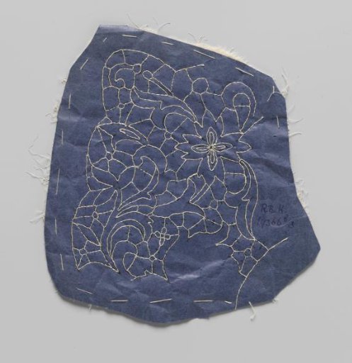 Prickings pinned to a double piece of cotton with tracing threads for making part of a needle lace collar