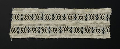 Strip of linen with blue and white lace embroidery with drawn threads
