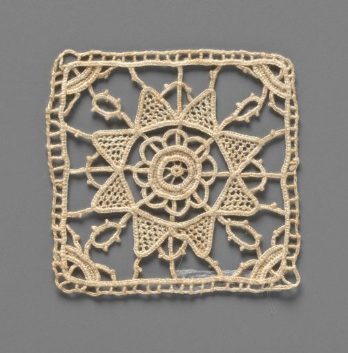 Doily of needle lace with rosette in eight-pointed star