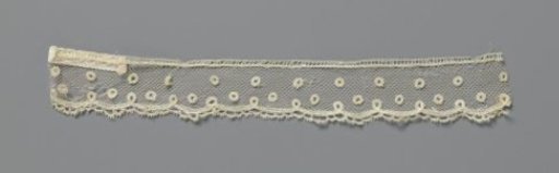 Strip of appliqué lace with circles and loops