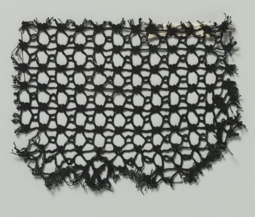 Fragment of bobbin lace with crosses between seven horizontal lines
