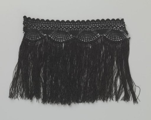 Strip of black crocheted lace with fringe