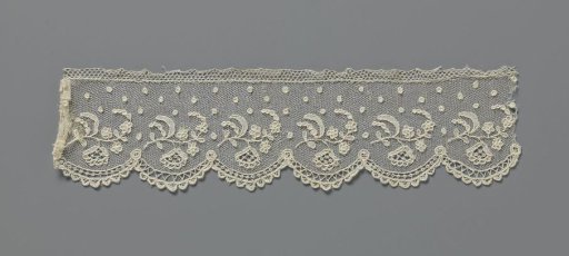 Needle lace strip with fan flower in arching garlands