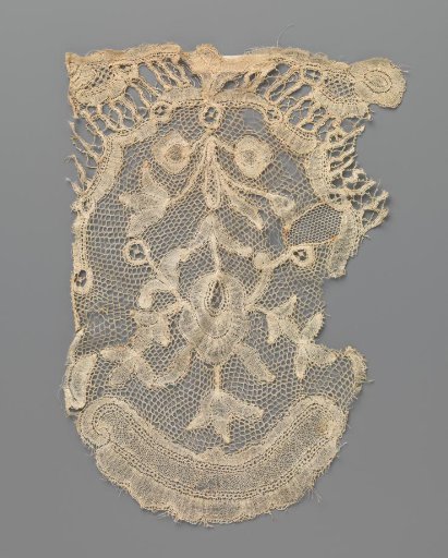 Fragment of bobbin lace with one flower branch
