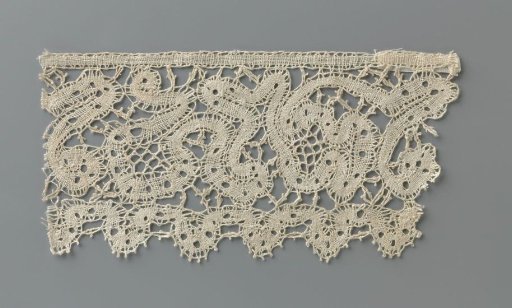 Strip of Bobbin Lace with a Continuous Swirling Ribbon Forming Fanciful Flowers