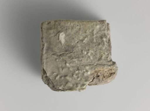 Fragment of a partially glazed brick