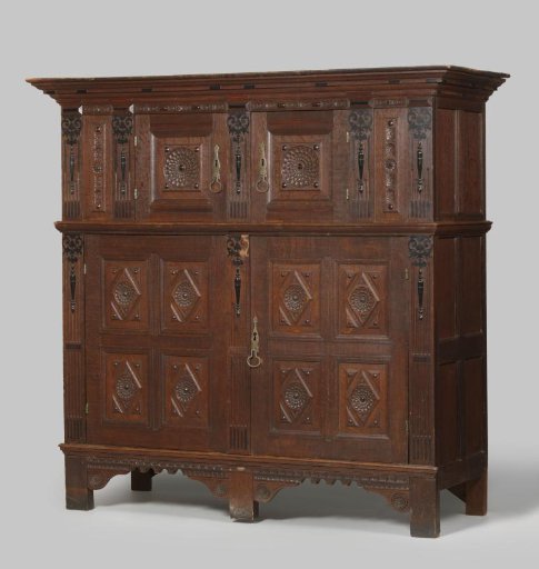 Four-Door Cabinet with Panels Featuring Rosettes