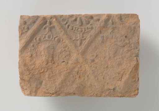 Fireplace with Depictions of a Male and Female Head