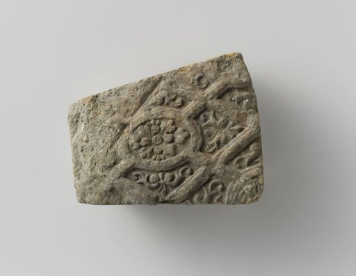 Arch stone with image of floral work and panes