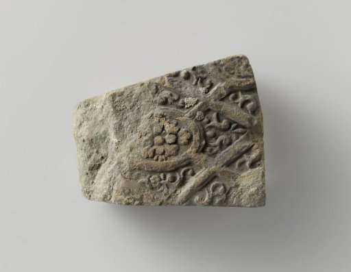 Arch stone with image of floral work and panes