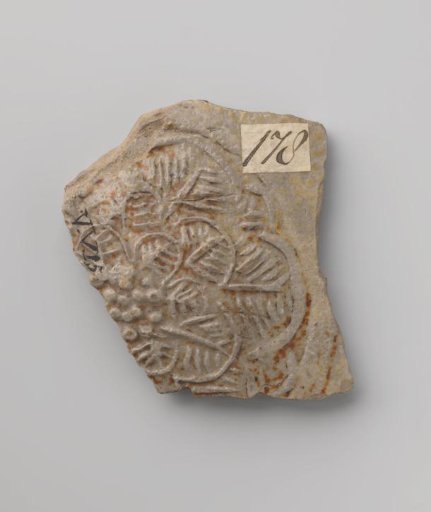 Fragment of a jug with a flower roundel