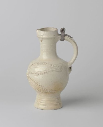 Jug with a mask and stylized leaves