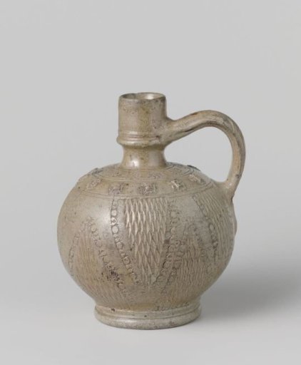 Jug with masks, flowers and chip carving