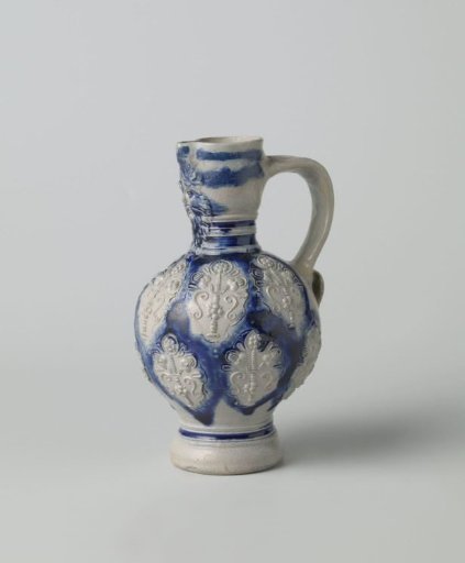 Jug with a mask and flower vases