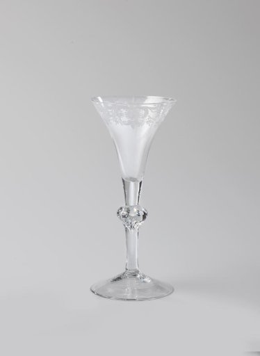 Chalice glass with an ornamental border