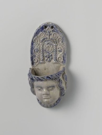 Holy water stoup in the shape an angel's head