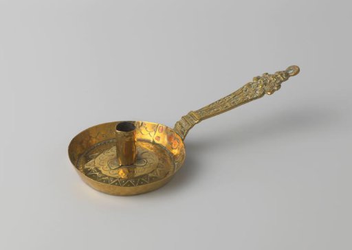 Brass candelabrum decorated with standing figures and a lion's head