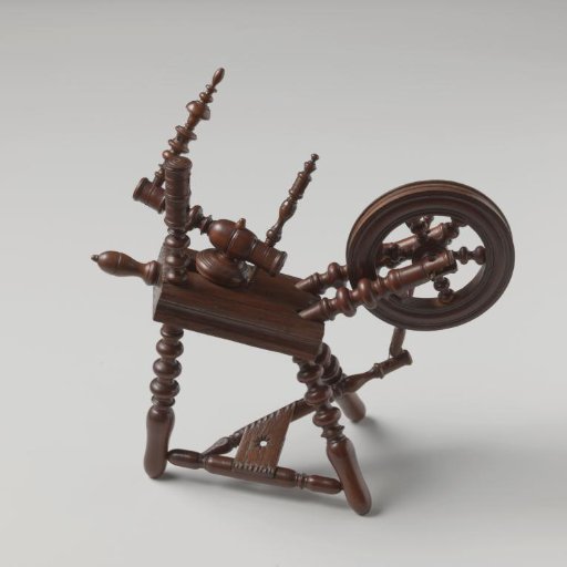 Spinning wheel, miniature, with twisted spokes