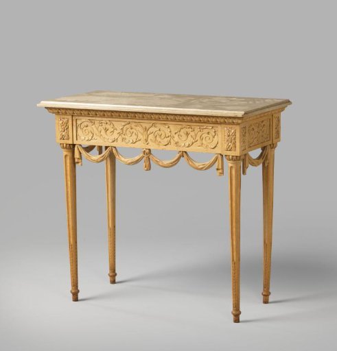 Writing table with fluted legs and acanthus and drapery ornamentation along the rails