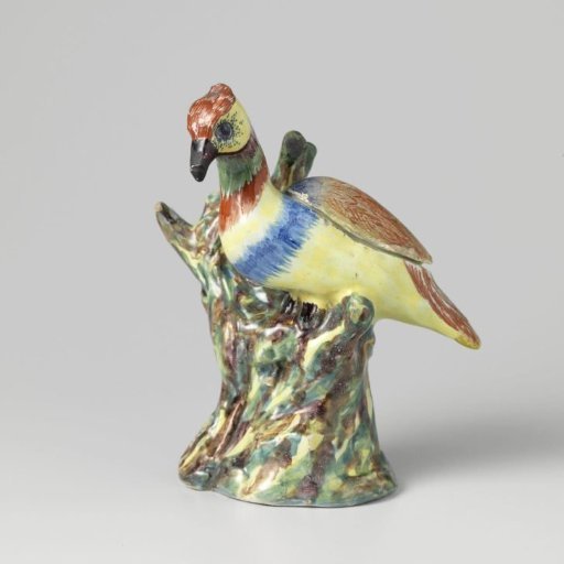 Bird on a tree trunk of faience