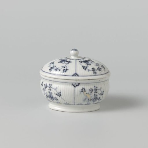 Sugar bowl with flowering plants in panels