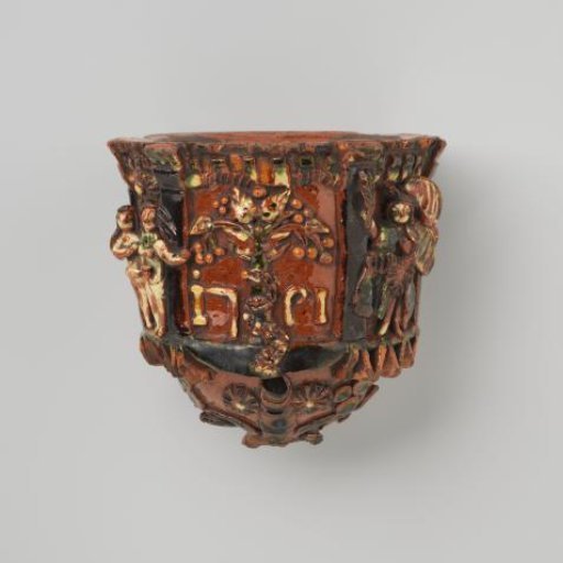Holy water font of lead-glazed earthenware