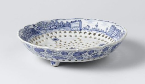 Fruit dish of blue-painted faience, with holes in a star shape