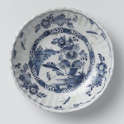 Dish, ribbed, decorated on the base with a flowerpot on a table