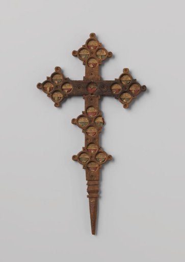 Wooden cross with round recesses for relics