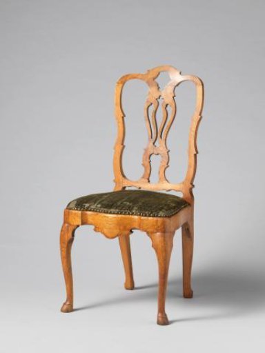 Chair with upholstery of pressed velvet featuring a pattern of a laurel-crowned male head on the back