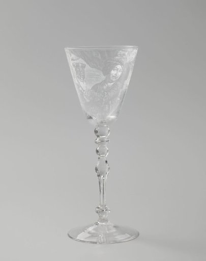 Wine glass with a man holding a birch broom